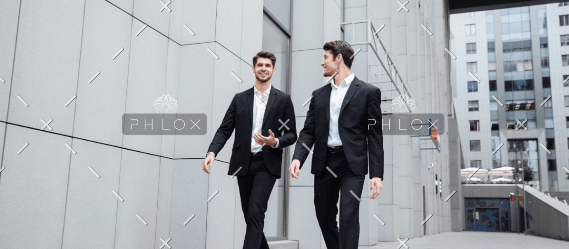 demo-attachment-922-two-businessmen-walking-and-talking-in-the-city-PMW8E26